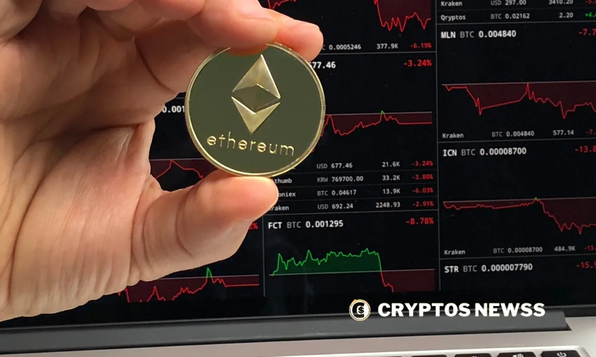 Ethereum coin held in hand with red charts in background reflecting market volatility and whale decline