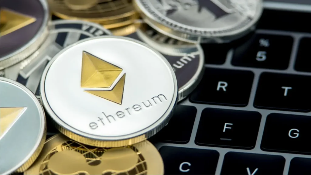 Ethereum and other cryptocurrency coins on keyboard representing Solana and Litecoin ETF investment decisions