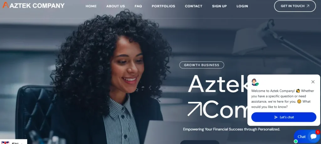 Screenshot of Aztek Company homepage featuring a woman working on a laptop with chat widget visible