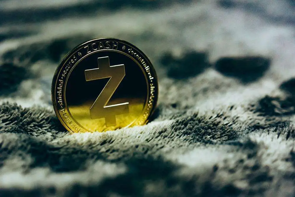 Close up of a Zcash coin on textured fabric representing the strong weekly surge and growing institutional interest