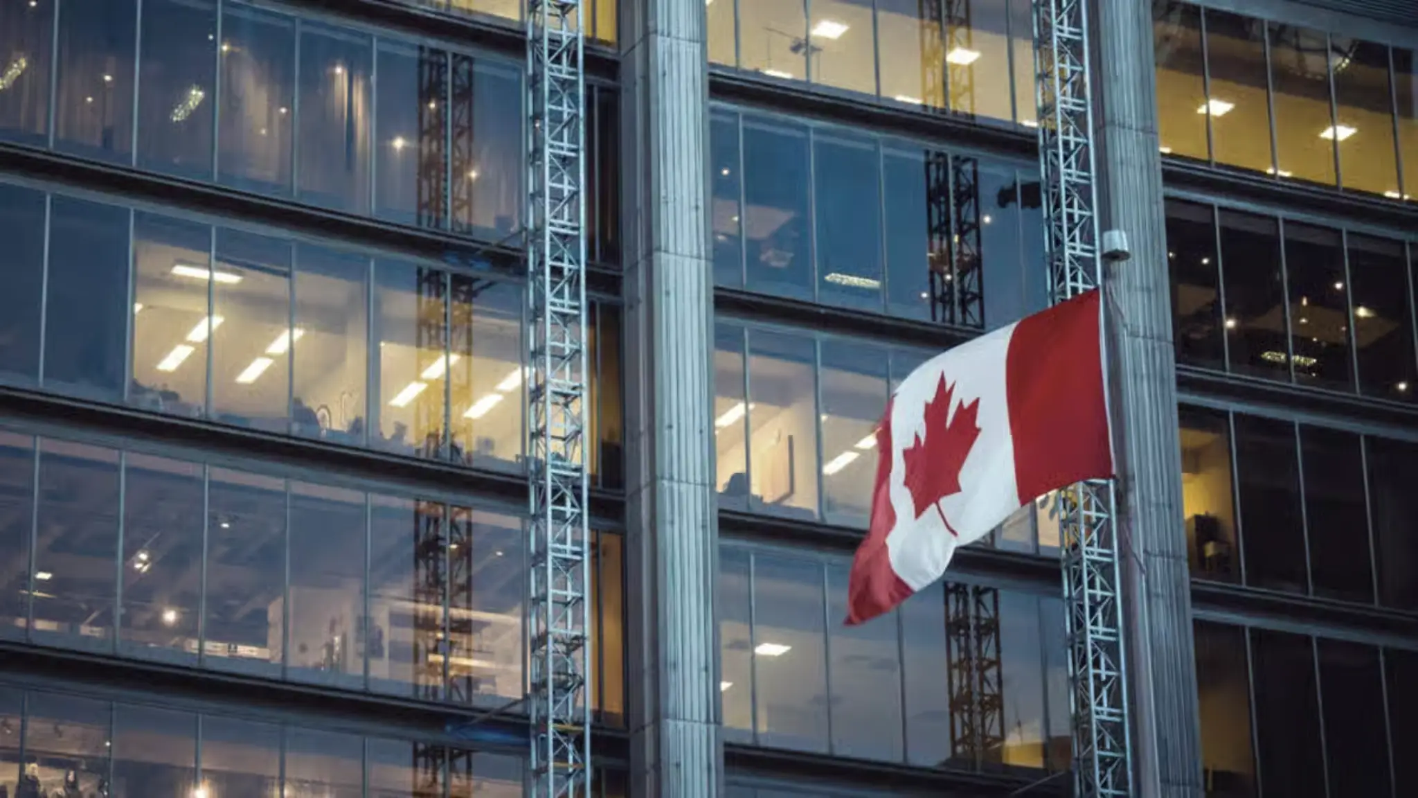 Canadian flag outside a government building representing Vancouver Bitcoin Reserve Motion discussion about holding Bitcoin reserves
