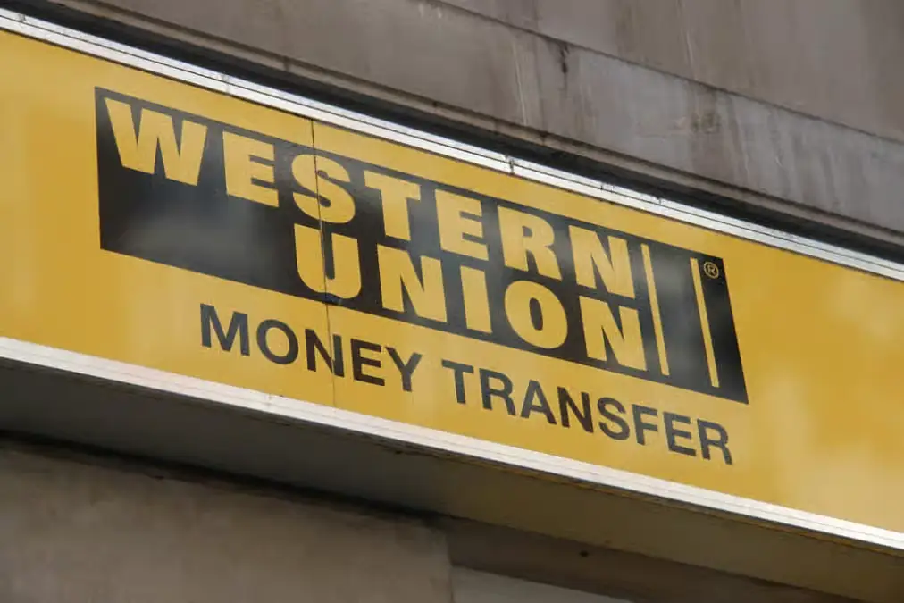 Western Union money transfer signboard on building exterior for international remittance services
