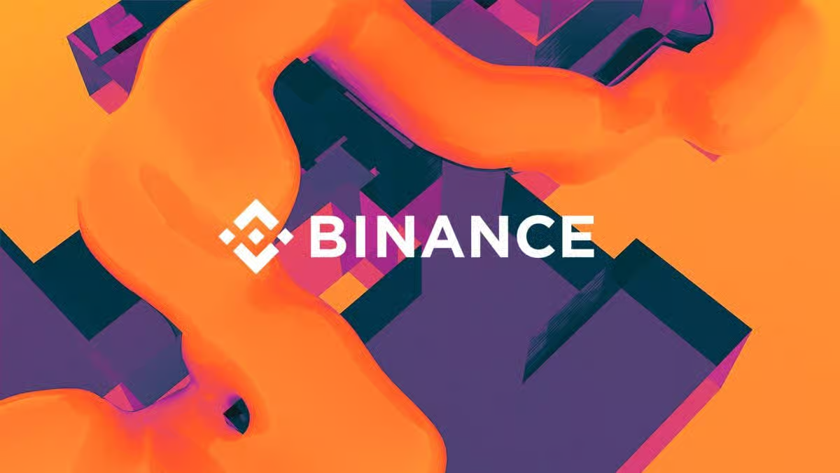 The white Binance cryptocurrency exchange logo and icon placed over a vibrant abstract background featuring orange fluid shapes and purple 3D geometric blocks.