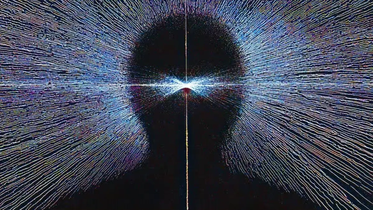 Abstract silhouette of a human head formed by glowing blue particles and light rays representing AI digital mind and neural network concepts