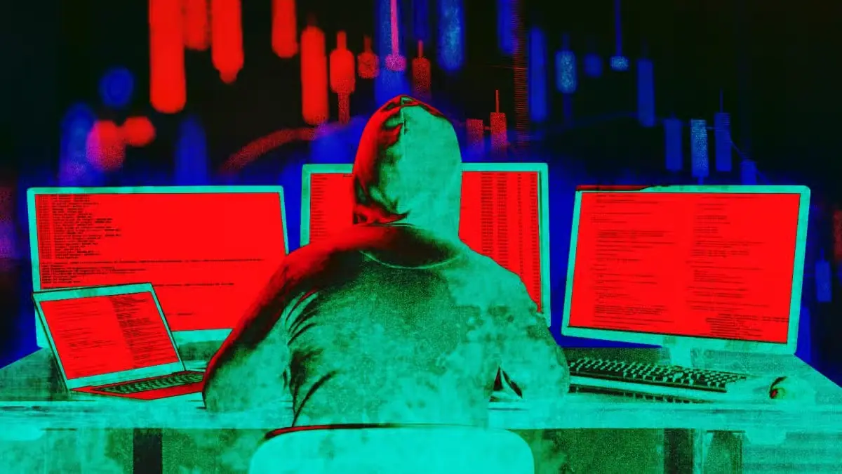 Hooded hacker sitting at multiple computer screens showing red code and trading charts during Fogo mainnet halt incident