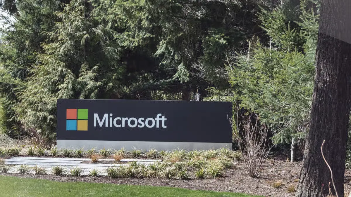 Microsoft sign outside its headquarters surrounded by trees