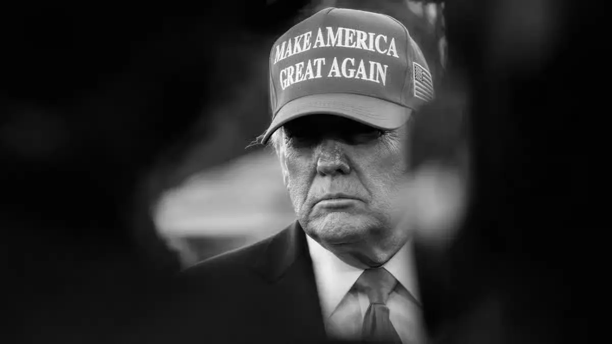 Black and white portrait of a political figure wearing a Make America Great Again campaign hat, representing U.S. politics, elections, and political movements.