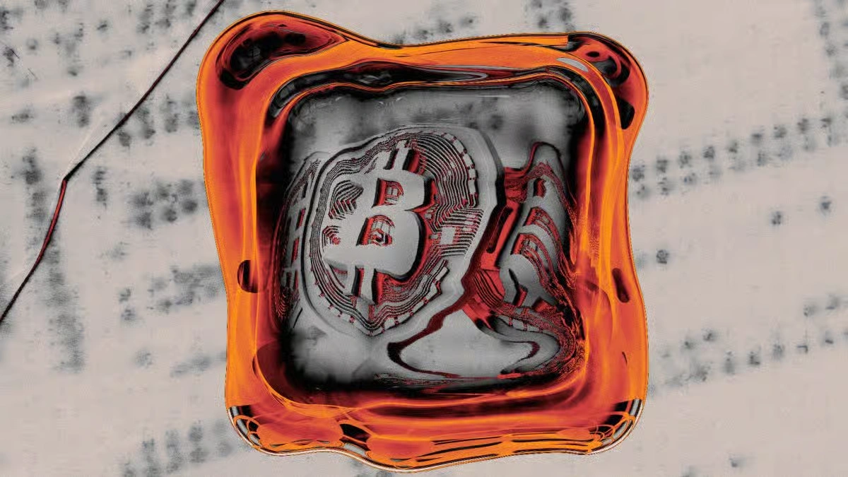 Bitcoin symbol enclosed inside a square orange-bordered ice cube to represent cryptocurrency cold storage concept.