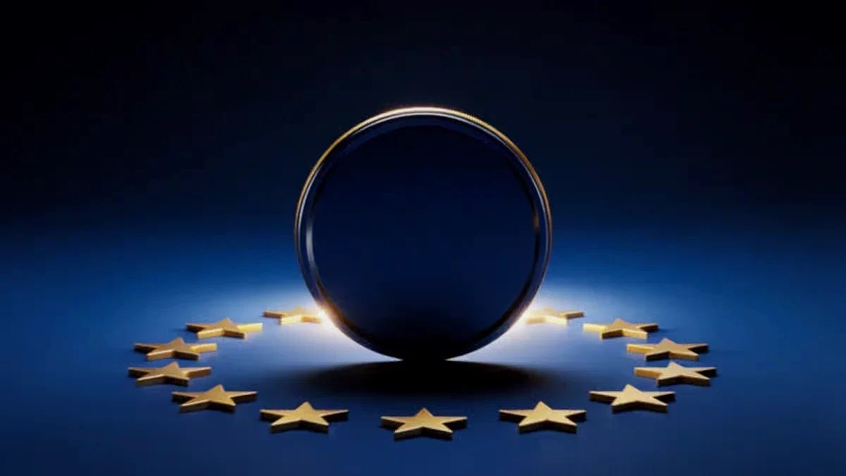 A 3D render of golden stars arranged in a circle like the European Union flag with a dark blank coin in the center over a blue background.